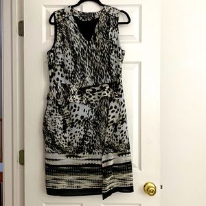 Black animal print mock wrap fully lined fitted sleeveless dress.Size Uk16/us 12